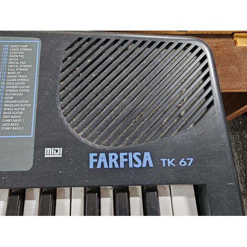 148 - A good quality Farfisa TK57 electronic keyboard with stand, in working order, has an electronic soun... 