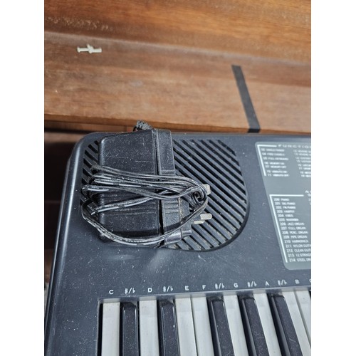 148 - A good quality Farfisa TK57 electronic keyboard with stand, in working order, has an electronic soun... 
