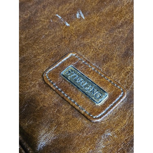 150 - A quantity of collectables to include a leather style Sterling foldable suit bag, a pair of mustard ... 