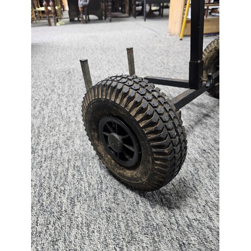 150A - A good quality heavy duty metal two wheeled trolley for transporting fishing equipment, set on a stu... 