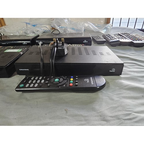 151 - A large collection of 7 sat boxes to include 2x Grundig Free sat boxes No. GUFSAT02SD,  3x Bush free... 