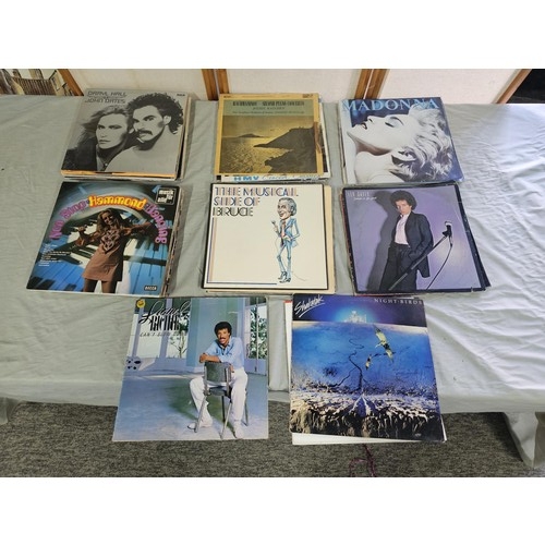 152 - A collection of LP's covering various genres to include Lionel Richie, Madonna, Leo Sayer, Rachmanin... 