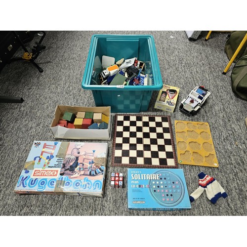 157 - Green crate containing a large quantity of assorted toys to include wooden building blocks, chess bo... 