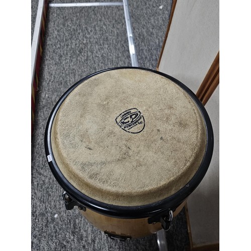170 - A good quality single conga drum in good order labelled Cosmic Percussion with a beech base. Stands ... 