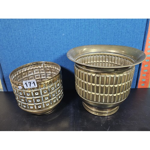 171 - A quantity of collectable brassware to include a Lipton tea orb shaped tea caddie with a lion symbol... 