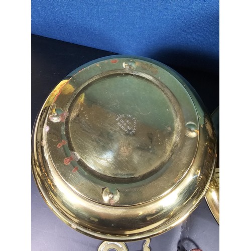 171 - A quantity of collectable brassware to include a Lipton tea orb shaped tea caddie with a lion symbol... 