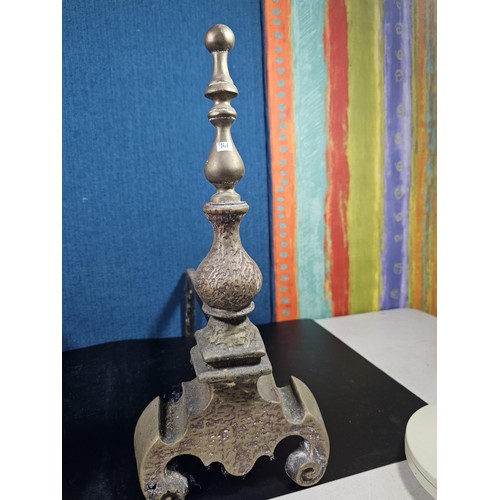 172 - A pair of good quality antique cast iron fire dogs standing on scrolled feet with finial top, both i... 