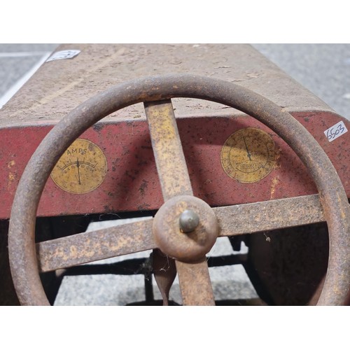 173 - A vintage metal Teddy pedal car in red in need of restoration, the car is stamped Teddy to the front... 