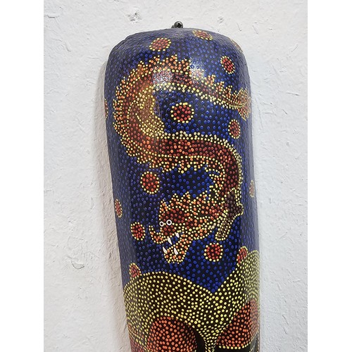 176 - A collection of 4 wall hanging original wooden ethnic face masks, 1 is in striking red, blue and yel... 