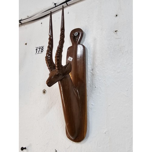 178 - A pair of antique hand carved antelope wall hangers made out of a solid piece of wood, the antelope ... 