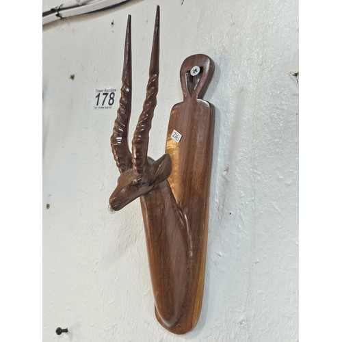 178 - A pair of antique hand carved antelope wall hangers made out of a solid piece of wood, the antelope ... 