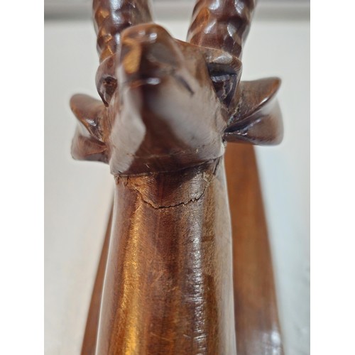 178 - A pair of antique hand carved antelope wall hangers made out of a solid piece of wood, the antelope ... 