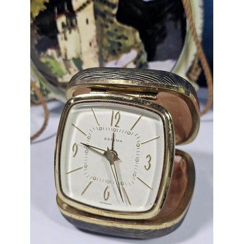 180 - A shelf containing a small quantity of collectables to include a Colibri ceramic tabletop lighter wi... 