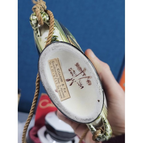 180 - A shelf containing a small quantity of collectables to include a Colibri ceramic tabletop lighter wi... 