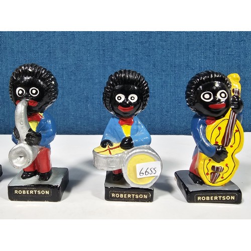 182 - A collection of 6 Robertson's Gollys from the band series to include a drummer, saxophonist, trumpet... 
