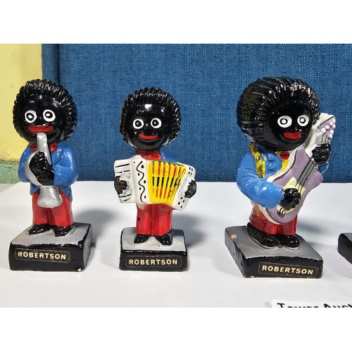 182 - A collection of 6 Robertson's Gollys from the band series to include a drummer, saxophonist, trumpet... 