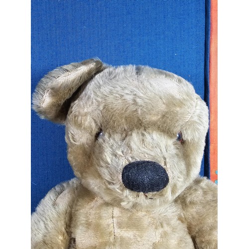 131 - A vintage Chad Valley teddy bear in need of restoration has been well loved has weat to his chest ar... 