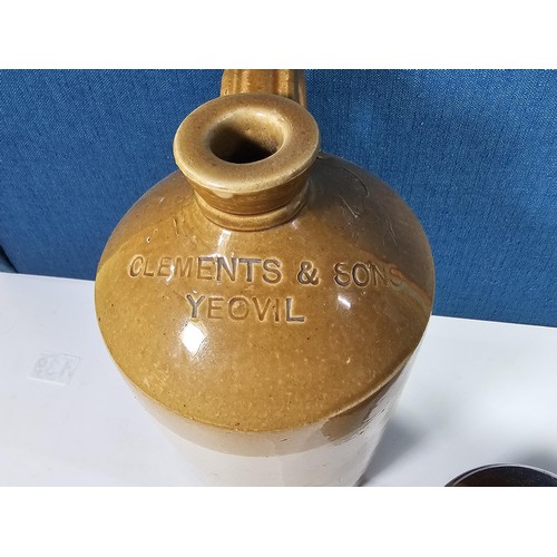 139 - A collection of Stoneware flagons to include a Clements and Sons of Yeovil flagon, along with two Co... 