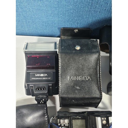 158 - Box of assorted cameras and accessories, to include a Minolta 7000 camera with a 35-70 lens, a Zenit... 