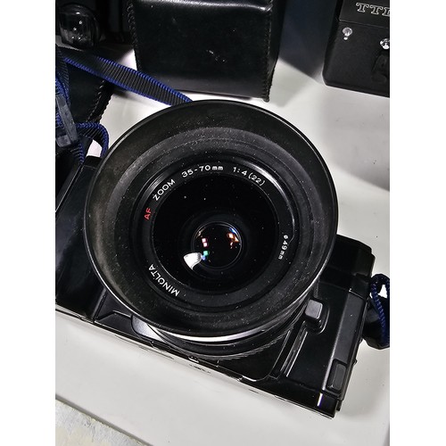 158 - Box of assorted cameras and accessories, to include a Minolta 7000 camera with a 35-70 lens, a Zenit... 