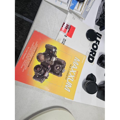 158 - Box of assorted cameras and accessories, to include a Minolta 7000 camera with a 35-70 lens, a Zenit... 