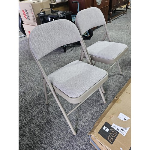 3 - A boxed as new Tailor & Brown padded fabric folding chairs in a beige colour, the box has been opene... 