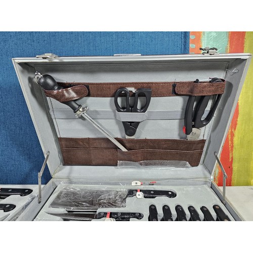 16 - A brown padded cased Rosenbaum set of kitchen knives and accessories on 2 trays, to include a full s... 