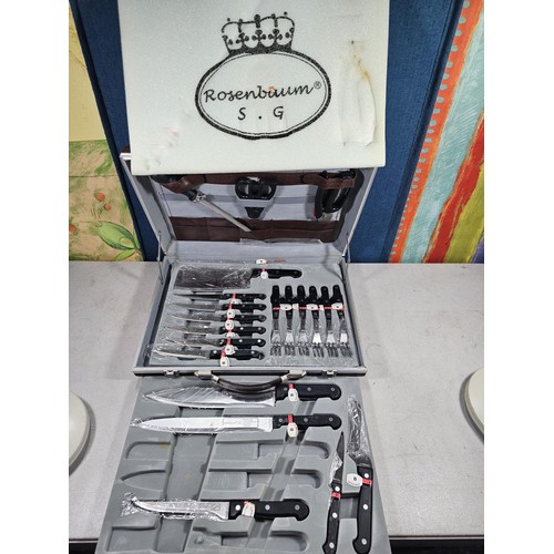 16 - A brown padded cased Rosenbaum set of kitchen knives and accessories on 2 trays, to include a full s... 
