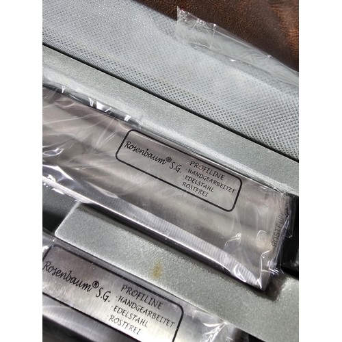 16 - A brown padded cased Rosenbaum set of kitchen knives and accessories on 2 trays, to include a full s... 