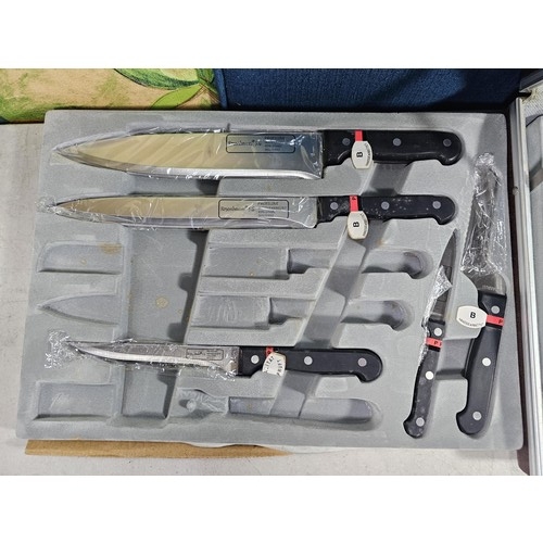 16 - A brown padded cased Rosenbaum set of kitchen knives and accessories on 2 trays, to include a full s... 