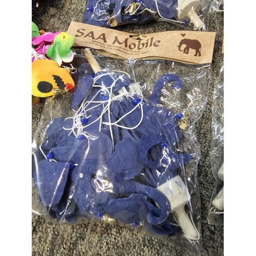 22 - A box containing a quantity of SAA mobile home made paper mobiles from Thailand, each packet contain... 