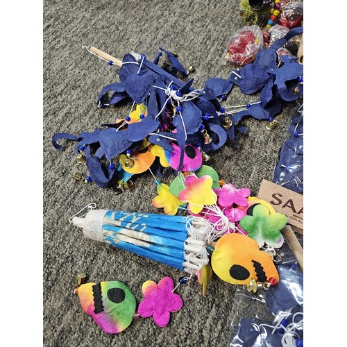 22 - A box containing a quantity of SAA mobile home made paper mobiles from Thailand, each packet contain... 