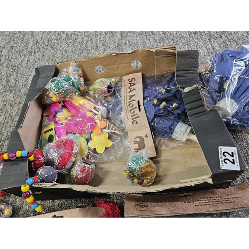 22 - A box containing a quantity of SAA mobile home made paper mobiles from Thailand, each packet contain... 