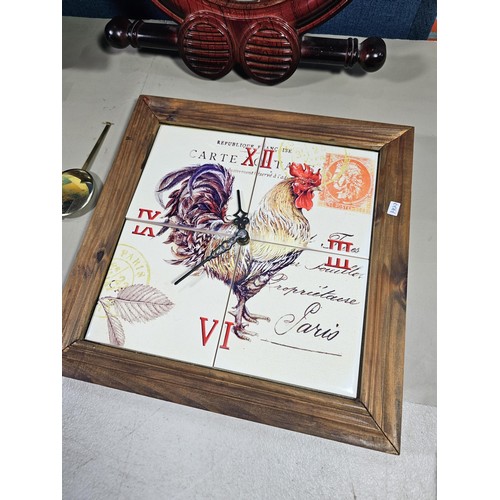 38 - A collection of 3 quartz battery operated clocks to include a wall hanging owl formed clock, a wall ... 