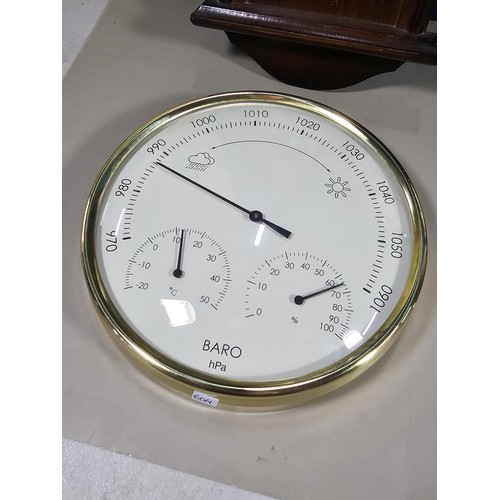 38 - A collection of 3 quartz battery operated clocks to include a wall hanging owl formed clock, a wall ... 