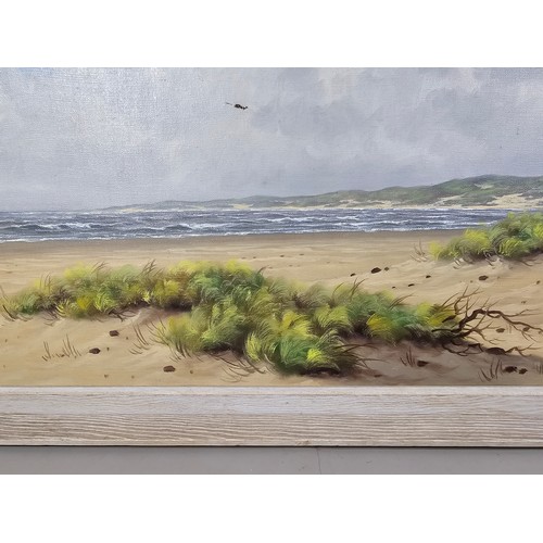 56 - A large original oil on canvas of a beach scene signed A.H Nordbery, the painting has a small hole i... 