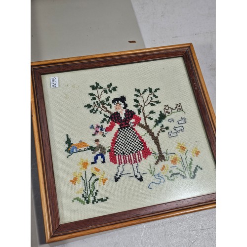 61 - 4x framed and glazed needlework pictures to include a white framed image of purple flowers, a gilt f... 