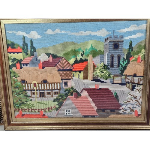 61 - 4x framed and glazed needlework pictures to include a white framed image of purple flowers, a gilt f... 