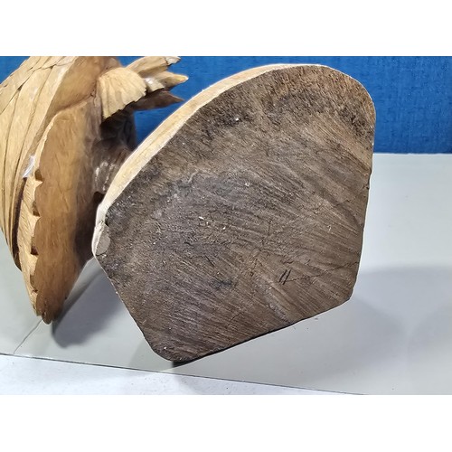 70 - A good quality hand carved solid wood eagle figure standing on a plinth, in very good detail. Has a ... 