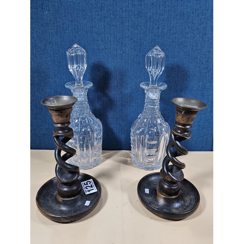 125 - A quantity of collectables to include a pair of barley twist wooden candlesticks and a pair of cut g... 