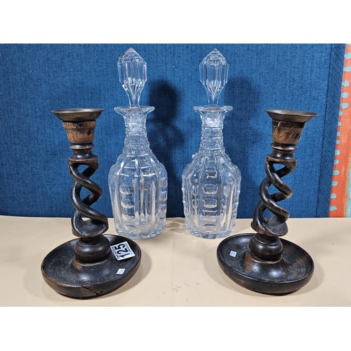 125 - A quantity of collectables to include a pair of barley twist wooden candlesticks and a pair of cut g... 