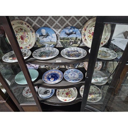 127 - A large collection of picture plates by Wedgwood and Royal Doulton of various designs to include air... 