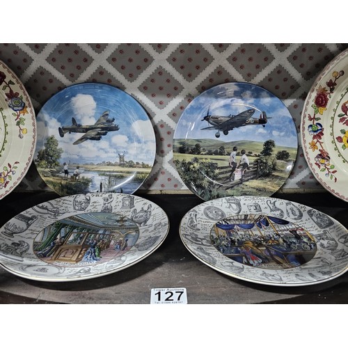 127 - A large collection of picture plates by Wedgwood and Royal Doulton of various designs to include air... 