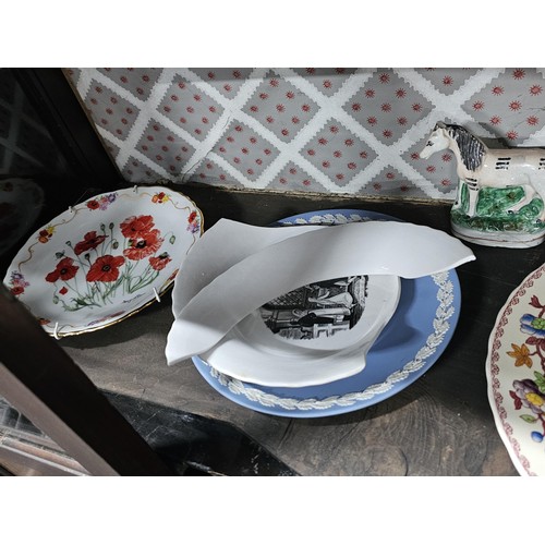 127 - A large collection of picture plates by Wedgwood and Royal Doulton of various designs to include air... 