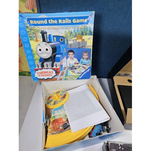 179 - 3x boxed items to include a boxed LED light box, a Thomas the Tank and Friends train set by Ravensbu... 