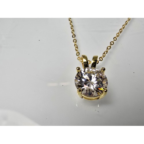 368 - A stunning brand new gold on 925 silver solitaire pendant and necklace set with a large 2ct clear ro... 