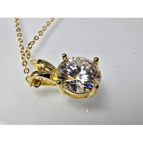 368 - A stunning brand new gold on 925 silver solitaire pendant and necklace set with a large 2ct clear ro... 