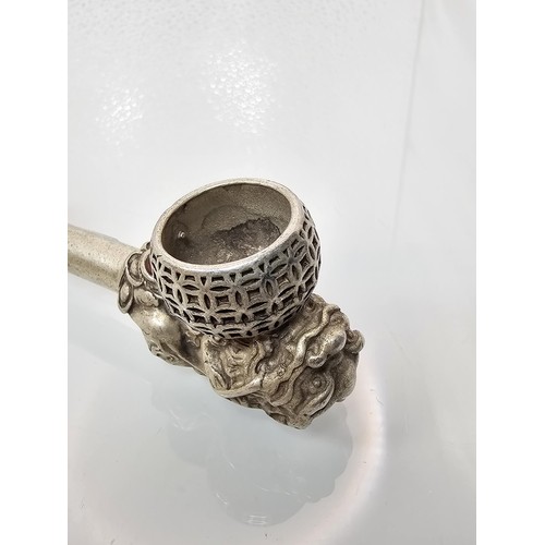 386 - An impressive ornate white metal long Asian Smoking Pipe having a jewelled design to the centre of t... 
