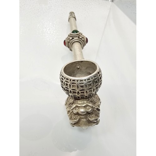 386 - An impressive ornate white metal long Asian Smoking Pipe having a jewelled design to the centre of t... 