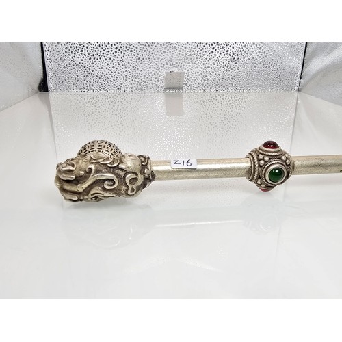 386 - An impressive ornate white metal long Asian Smoking Pipe having a jewelled design to the centre of t... 